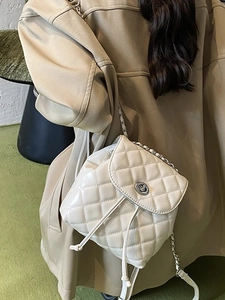 Quilted rhombus mini backpack in cream white with chain strap and metal lock closure