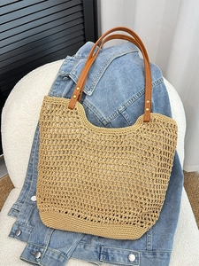 Summer woven straw tote bag with brown leather handles and hollow knit design