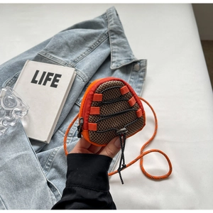 Detail of mini orange crossbody wallet with mesh pocket and drawstring closure