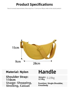Detail showing dimensions 28x15x9cm of the yellow nylon half moon crossbody dumpling bag