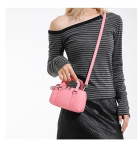 Detail view of pink lychee pattern PU leather Boston bag with silver fashion logo
