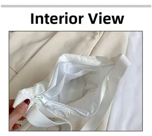 Internal display of white nylon crossbody bag showing the inner compartment and lining