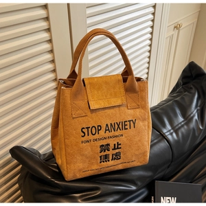 Macro shot of waterproof DuPont paper tote bag with STOP ANXIETY printed text