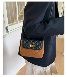 Detail of vintage quilted crossbody bag with black leather and brown suede contrast