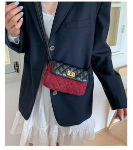 Detail of color-block quilted mini crossbody bag with gold-tone twist lock and shoulder strap