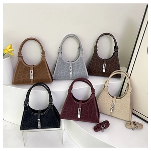 Collection of leopard-embossed tote bags in six colors with metallic piston clasp