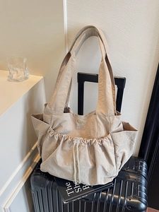 Light khaki large capacity drawstring tote bag with side pockets for daily commute