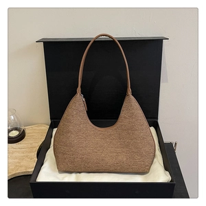 Brown tweed hobo bag with leather strap presented in a premium gift box set