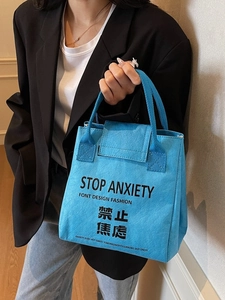 Blue Tyvek tote bag with black letter print, waterproof modern handbag for commuters