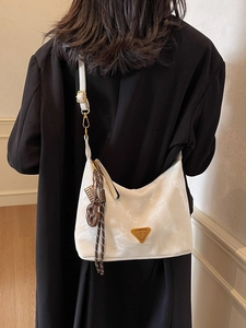 Minimalist marble pattern white crossbody bag with gold triangle plate and model back view