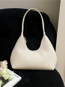 Chic cream white crescent hobo bag in lychee textured leather for summer commute
