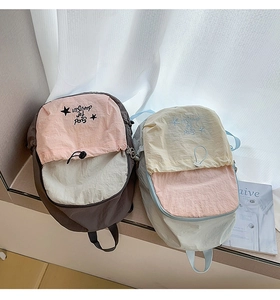Detail of Korean style contrasting colors drawstring backpacks with star embroidery