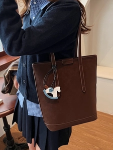 Classic dark brown suede tote bag for women with a cute blue rocking horse charm