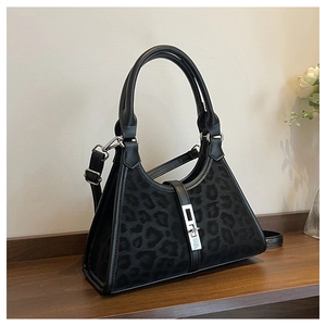 Close-up of leopard print bucket bag with silver metal buckle and black handle