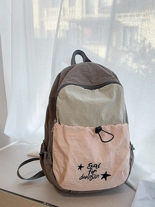 Three-color patchwork nylon backpack with drawstring pocket and elegant embroidery