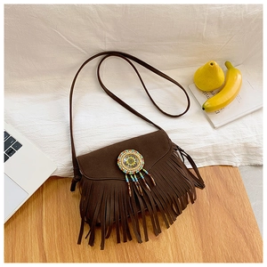 Detail of dark brown suede fringe bag with bohemian beaded sunflower and tassel