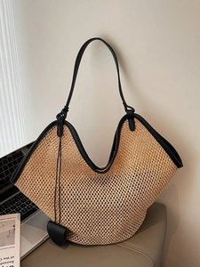 French straw tote bag with black leather trim and heart charm for summer beach vacation