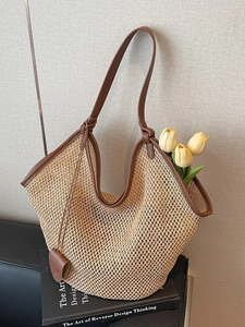 French style straw woven tote bag with brown leather handles for summer beach vacations