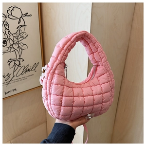 Detail of pink quilted puffer hobo bag with grid stitching and silver zipper closure