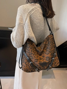 Large leopard print hobo shoulder bag with black leather straps and silver hardware detail