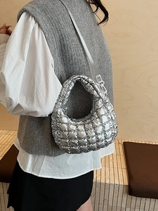 Chic silver quilted puffer shoulder bag with metallic finish and adjustable strap