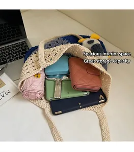 Top view of hollow crochet tote bag showing large capacity with umbrella and tablet