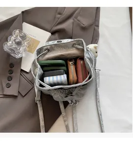Detailed interior view of the silver bucket bag showing large capacity for essentials