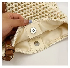 Close-up of woven tote bag showing magnetic buckle closure and durable inner lining