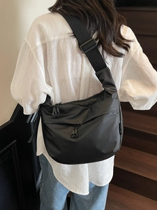 Large capacity black nylon crossbody bag for women, featuring a casual dumpling shape design