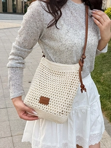 Handcrafted hollow out woven tote bag with brown leather straps for beach summer vacation