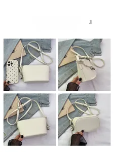 Detailed views of a white lychee grain bucket bag with silver heart charm and adjustable strap