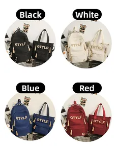 Macro display of nylon backpack set in black, white, blue and red with logo detail