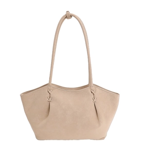 Borsa tote beige minimalista in ecopelle con tracolla annodata e cuciture decorative