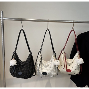 Three half-moon tote bags in tweed and dot patterns with cute plush sheep pendants