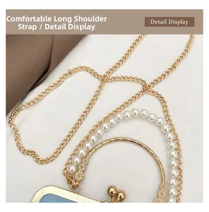 Detail view of blue vintage handbag with elegant gold metal chain and pearl handle strap