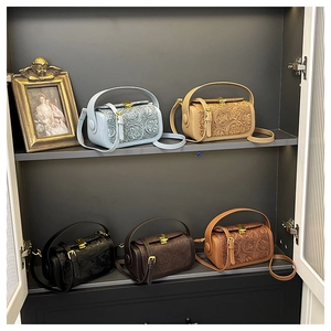 Detail view of retro small box bags in five colors with floral embossed leather finish