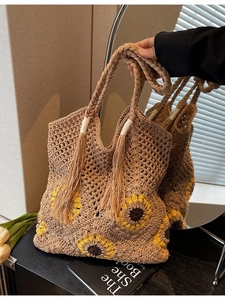 Handmade crochet sunflower straw tote bag with long tassels for summer beach vacation use