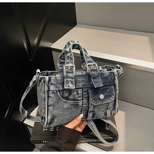 Detailed view of durable denim tote bag with vintage wash and adjustable shoulder strap