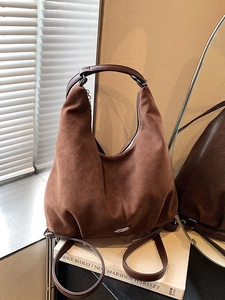 Minimalist large brown hobo bag in high-quality suede texture with silver metal logo
