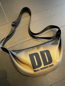 Stylish nylon crescent crossbody bag with metallic black and gold gradient and logo
