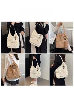 Detail showing hand-crocheted hollow pattern and side tassels on bohemian hobo bag