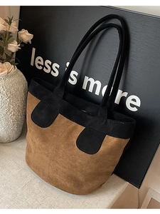 Minimalist two-tone suede tote bag in brown and black with long shoulder straps