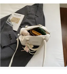 Top view of cream Boston bag interior showing spacious capacity for phone and umbrella