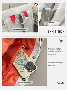 Detailed view of reinforced stitching, contrast handles, and orange interior zipper pocket