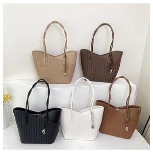 Detailed collection of textured tote bags in five colors with chic heart charm detail