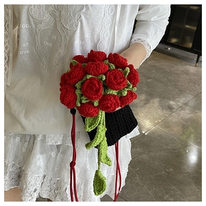 Detailed handmade crochet rose bouquet shoulder bag with red flowers and green leaves
