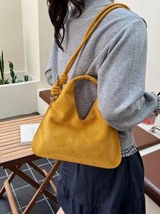 Fashionable yellow suede hobo bag with a knotted strap and large capacity for daily use
