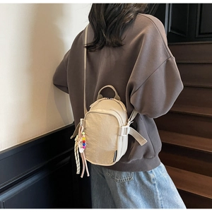 Nylon square crossbody bag with smiley bead charm and adjustable strap detail