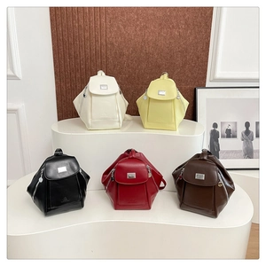 Group display of chic geometric PU leather backpacks in white, yellow, black, and burgundy