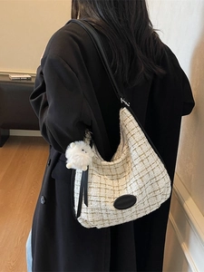 Chic tweed tote bag for women featuring a black leather patch and cute sheep charm detail